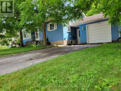 Cozy 2 bed 1.5 bath bungalow with full basement and attached 1 car garage. The basement features a l...