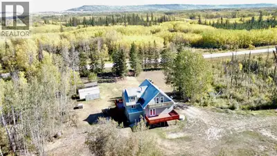 Welcome to country living just 15 minutes from Dawson Creek! This spacious 2-storey, 2000 sq' ft hom...