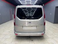 Experience the elegance and sophistication of the gold 2015 Ford Transit Connect Wagon Titanium with... (image 6)