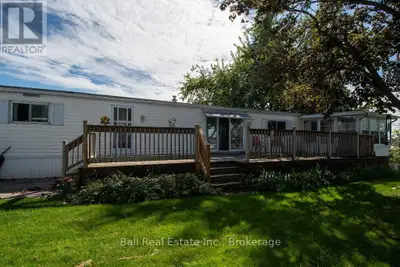 Welcome to this charming four-season modular home nestled in Shady Acres Park on the beautiful shore...