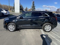 The 2024 Cadillac XT5 Standard AWD, finished in Stellar Black Metallic, combines refined styling, ad... (image 4)