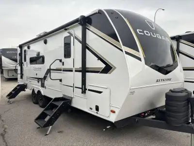 Keystone Cougar Half-Ton travel trailer 25RDSWE highlights: Private Bedroom Tri-Fold Sleeper Sofa Wa...