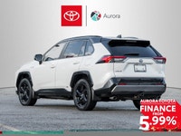 The 2019 Toyota RAV4 Hybrid XSE in pristine white exudes confidence on the road with its capable AWD... (image 5)