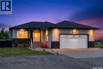 This one-of-a-kind walkout bungalow in Pilot Butte backs green space and offers a rare combination o...