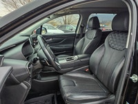 The 2022 Hyundai Santa Fe Hybrid Preferred in sleek Black with an AWD drivetrain offers balanced han... (image 9)