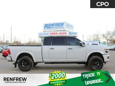 Renfrew Chrysler is proud to offer this Loaded Laramie with a custom Space Grey vinyl wrap, custom m...