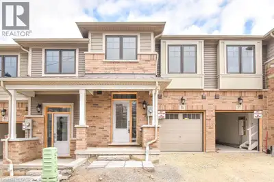 *Pictures are from before tenants moved in* This beautiful open-concept townhome offers 1,585 sq. ft...