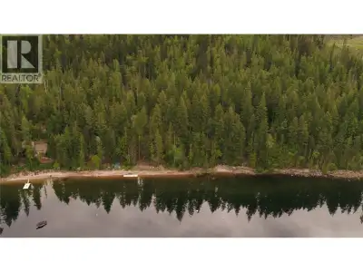 Welcome to Your Very Own Oasis on Mabel Lake! Experience 130 feet of breathtaking beach waterfront a...