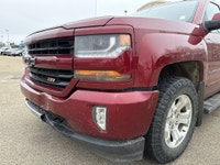 AMVIC Licensed Dealer This 2018 Chevrolet Silverado 1500 2LT is finished in striking Cajun Red Tintc... (image 2)