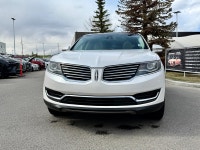 The 2016 MKX Reserve is characterized by its "Split-wing" front grille and a full-width LED taillamp... (image 3)