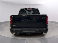 The 2026 Ram 1500 Big Horn, presented in a commanding Black finish and equipped with a robust 4x4 dr... (image 3)