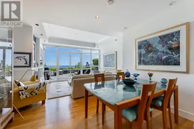 Welcome home to The Boulders! Unit 103 is a thoughtfully curated 2 bed & den, 3 bath home with stunn...