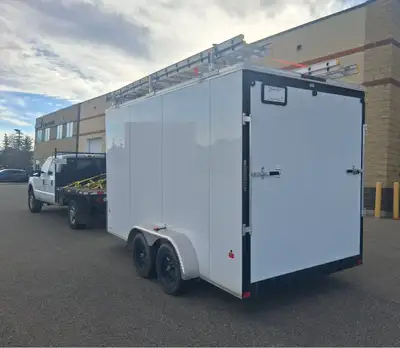 14' CARGO TRAILER WITH RAMP DOOR AND ALUMINUM ROOF RACKS FOR SALE. COMES COMPLETE WITH ALL THE PROFE...