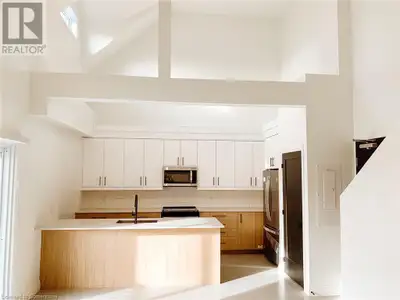 Welcome to suite 303 a one-of-a-kind two storey loft in the 150 Alma Luxury Apartments. Suite 303 fe...