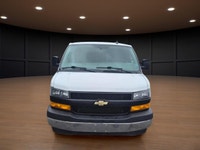 The 2020 Chevrolet Express Cargo Van 2500 Extended Wheelbase in a clean White finish, paired with re... (image 1)
