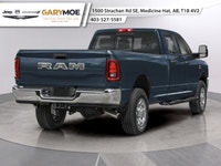 The 2026 Ram 3500 Laramie 4x4 Crew Cab with an 8 Box is a commanding presence, featuring a bold blue... (image 1)