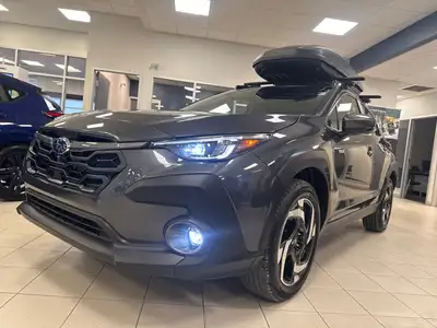 Introducing the 2026 Subaru Crosstrek Hybrid Limited AWD in a sleek gray finish that complements its...