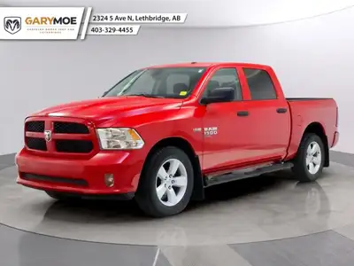 Introducing the Ram 1500 Classic Express 4x4 Crew Cab, a striking red truck that blends power and ca...
