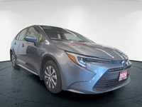 The 2023 Toyota Corolla Hybrid LE in stunning gray, boasts a fuel-efficient FWD drivetrain known for... (image 2)