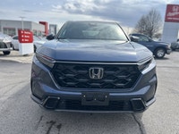 The 2024 Honda CR-V Hybrid EX-L in stunning Canyon River Blue Metallic offers an unparalleled blend... (image 1)