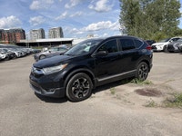 Le Honda CR-V Touring 2018 est un VUS compact haut de gamme reconnu pour sa fiabilité, son confort e... (image 6)