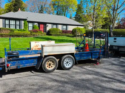 Open flat bed landscape trailer with 12 inch walls and heavy duty ramp Electric brakes. Electric win...