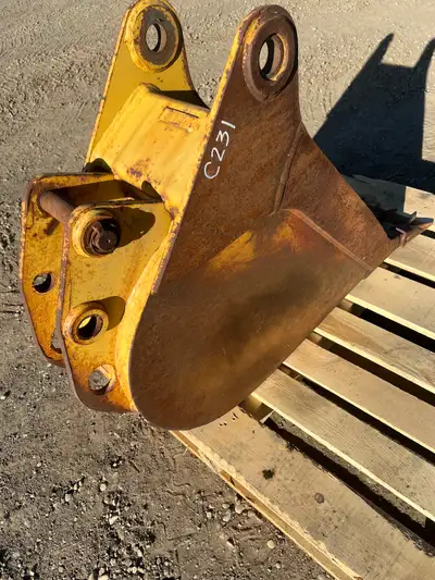 11.5” Trenching Frost Bucket. Top 10" Bottom 5 ¼" distance between lugs. Stock #C231. $1000. .