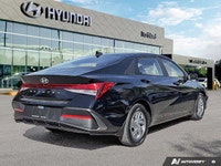 This 2024 Hyundai Elantra Essential shines with its sleek Abyss Black exterior and practical feature... (image 4)