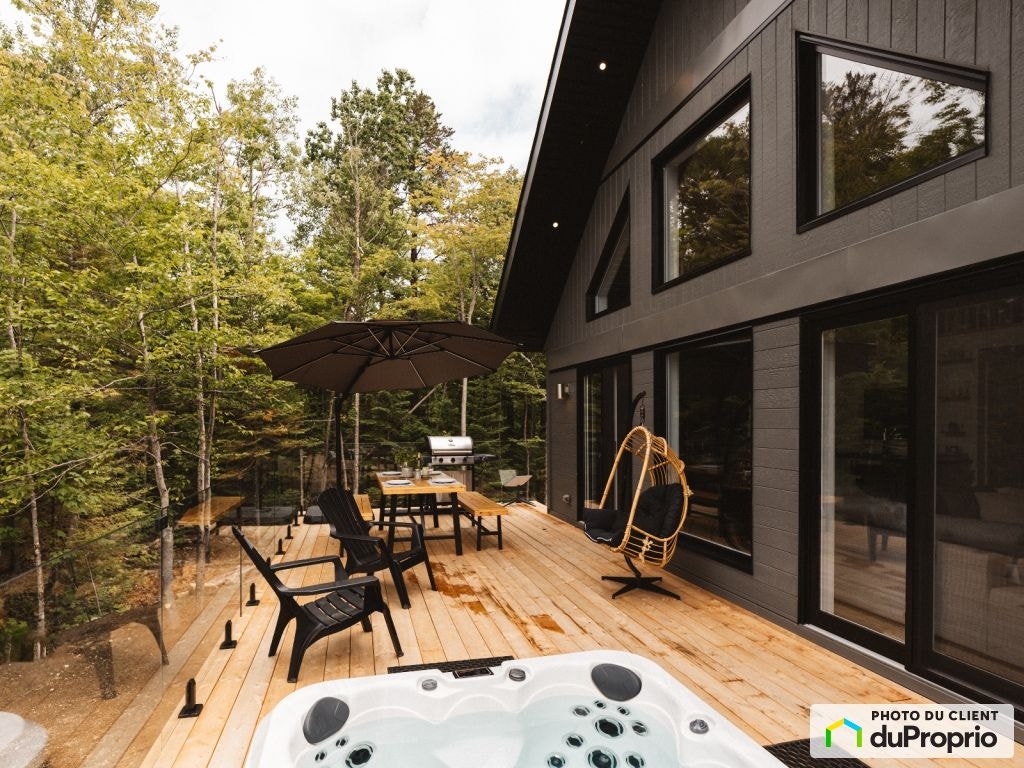$699,000 - Cottage for sale in St-Côme — photo 1