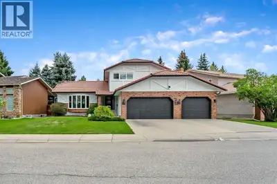 Tucked away in prestigious Woodbine Estates and just steps from Fish Creek Provincial Park, this bea...