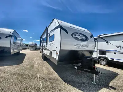 The 2026 Wolf Pack Limited 21PACK14+ toy hauler travel trailer is designed for adventure seekers who...