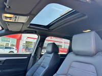 This 2021 Honda CR-V Sport, boasting a vibrant Radiant Red Metallic exterior and a sleek black inter... (image 6)
