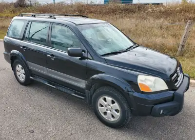 2004 Honda Pilot for sale with 250,000 for $2000. Roomy interior with eight-passenger seating, versa...