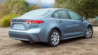 The 2020 Toyota Corolla LE, with its stunning blue exterior and efficient front-wheel drive, offers... (image 1)