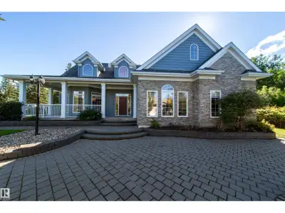 Luxurious Lakeside Living at Silver Beach Highly motivated sellers. Quick possession. This custom-bu...