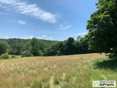 Très beau terrain prestigieux à 5 minutes de marche du village pittoresque de Fitch Bay, prêt à cons...
