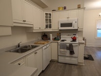 Located on a quiet tree-lined street, this first-floor apartment offers a home sized kitchen includi... (image 1)
