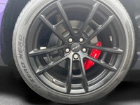 The 2023 Dodge Challenger SRT Hellcat Jailbreak in a stunning purple hue captivates with its rear-wh... (image 7)