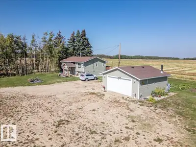 This Acreage with a Completely Renovated Home and a Double Detached Garage is located right off pave...