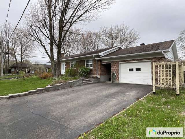 $595,000 - Bungalow for sale in St-Redempteur — photo 1