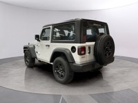 The 2026 Jeep Wrangler Sport 2 Door 4x4, presented in a striking white color, is equipped with a res... (image 2)
