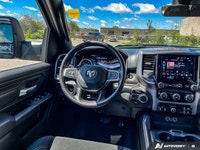 Odometer is 12404 kilometers below market average! Diamond Black Crystal Pearlcoat 2025 Ram 1500 Tra... (image 9)