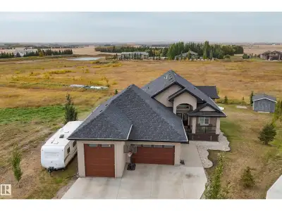 Discover exceptional country living in this large custom-built 2012 walkout bungalow offering 3700 t...