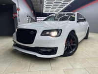 The 2023 Chrysler 300, particularly the 300C RWD in pristine white, is a powerful sedan that truly s... (image 2)