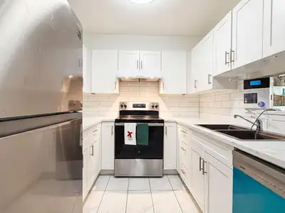 Best Value in Guildford! Bright TOP FLOOR south-facing 2-bedroom, 2-bathroom home offering 1,026 sq....