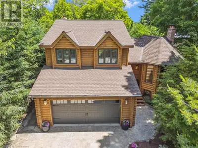 Stunning log exterior residence with an elegant carved door located in Elora. This property boasts 4...