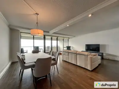 Magnifique condo ensoleillé au 14e étage, avec vue sur le fleuve depuis le salon et vue sur les Laur...
