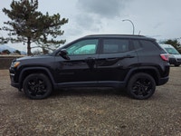 Step into the commanding presence of the 2018 Jeep Compass Altitude 4x4, cloaked in a stunning black... (image 4)