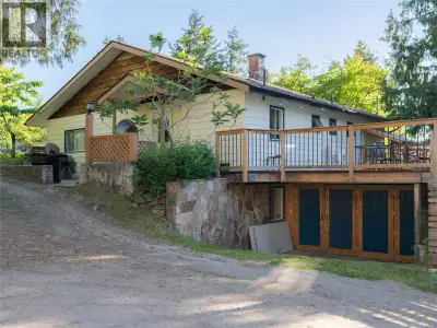 Tucked away on a quiet dead-end street beside Anderson Creek in Nelson's beloved Fairview neighbourh...