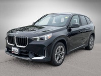 The 2025 BMW X1 xDrive28i arrives as a striking black Sport Utility vehicle, seamlessly blending ath... (image 6)